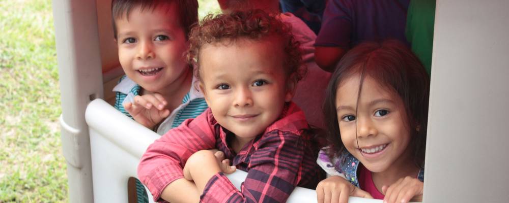 Children and parents at a Utah daycare, representing family support and access to affordable child care.